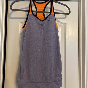 Nike woman’s dri fit workout tank size xl but fits more like a medium